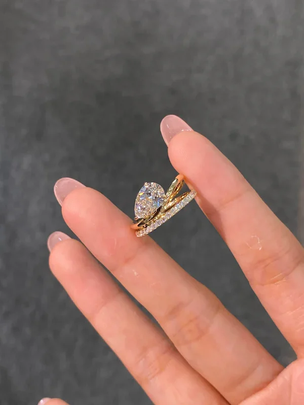 "Between the Fingers" Ring featuring Intertwined Double Bands and a Pear-Shaped Lab-Grown Diamond — D Color, VS1 Clarity