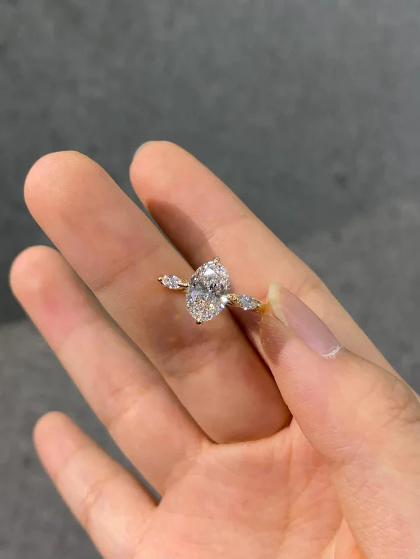 A unique three-stone diamond ring featuring an oval lab-grown diamond—dazzlingly brilliant, Color D, Clarity VS1